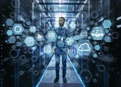 An IT professional standing in a data center surrounded by digital icons and network visuals, representing managed services and integrated IT operations.